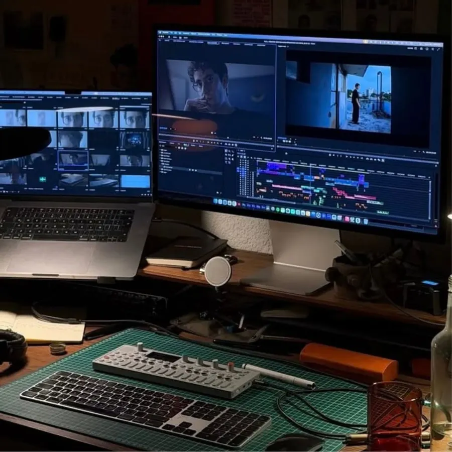 Dual-monitor editing setup with a video timeline open in the editing software